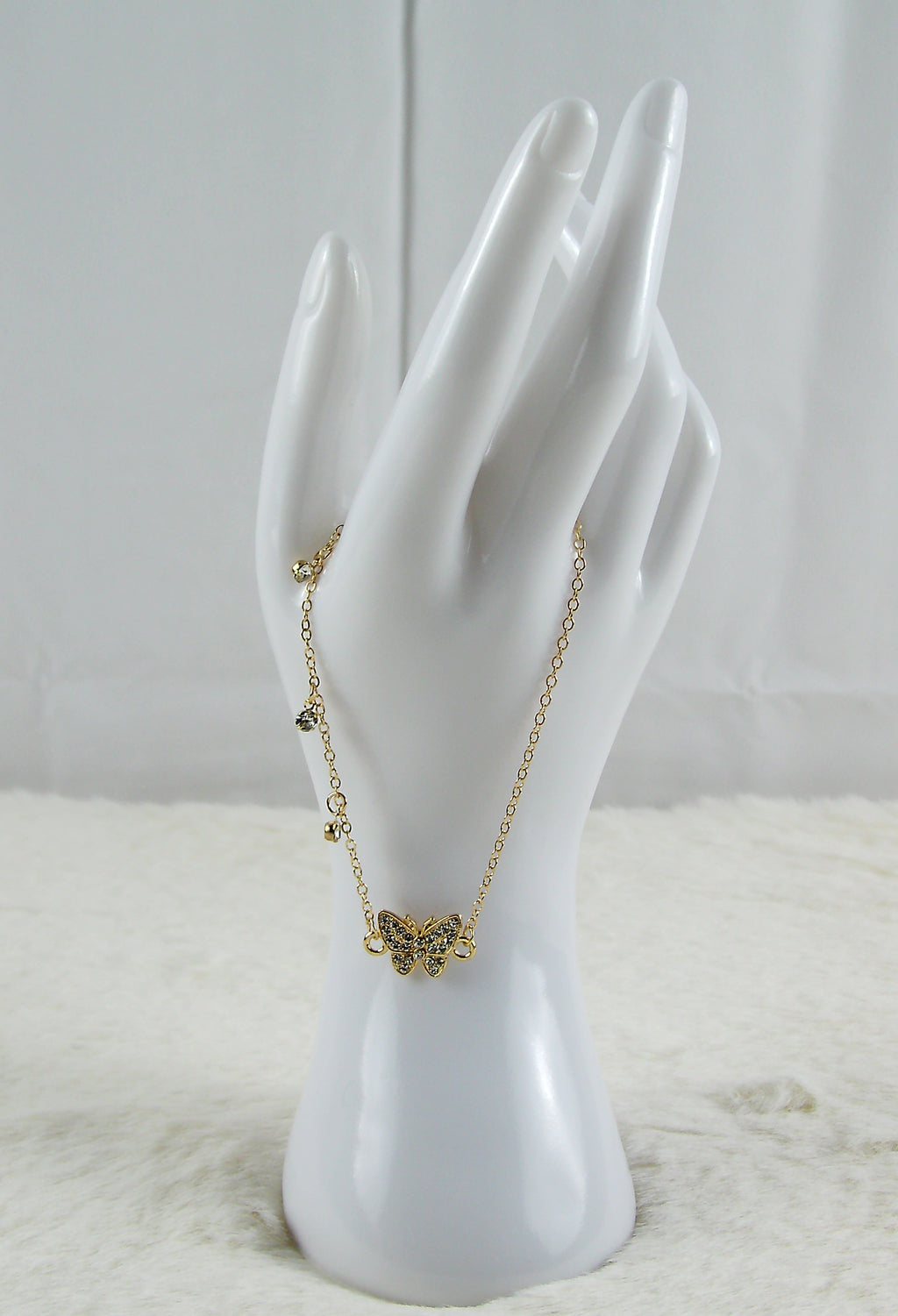 Gouden armband met vlinder diamantjes