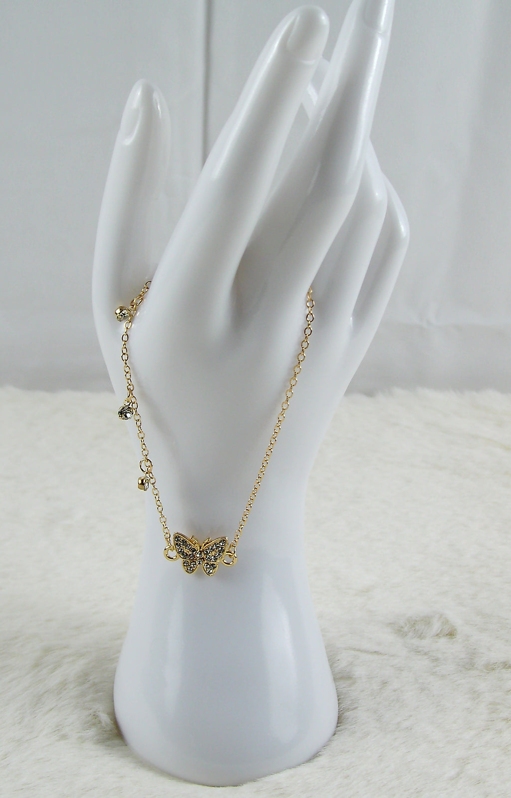 Gouden armband met vlinder diamantjes