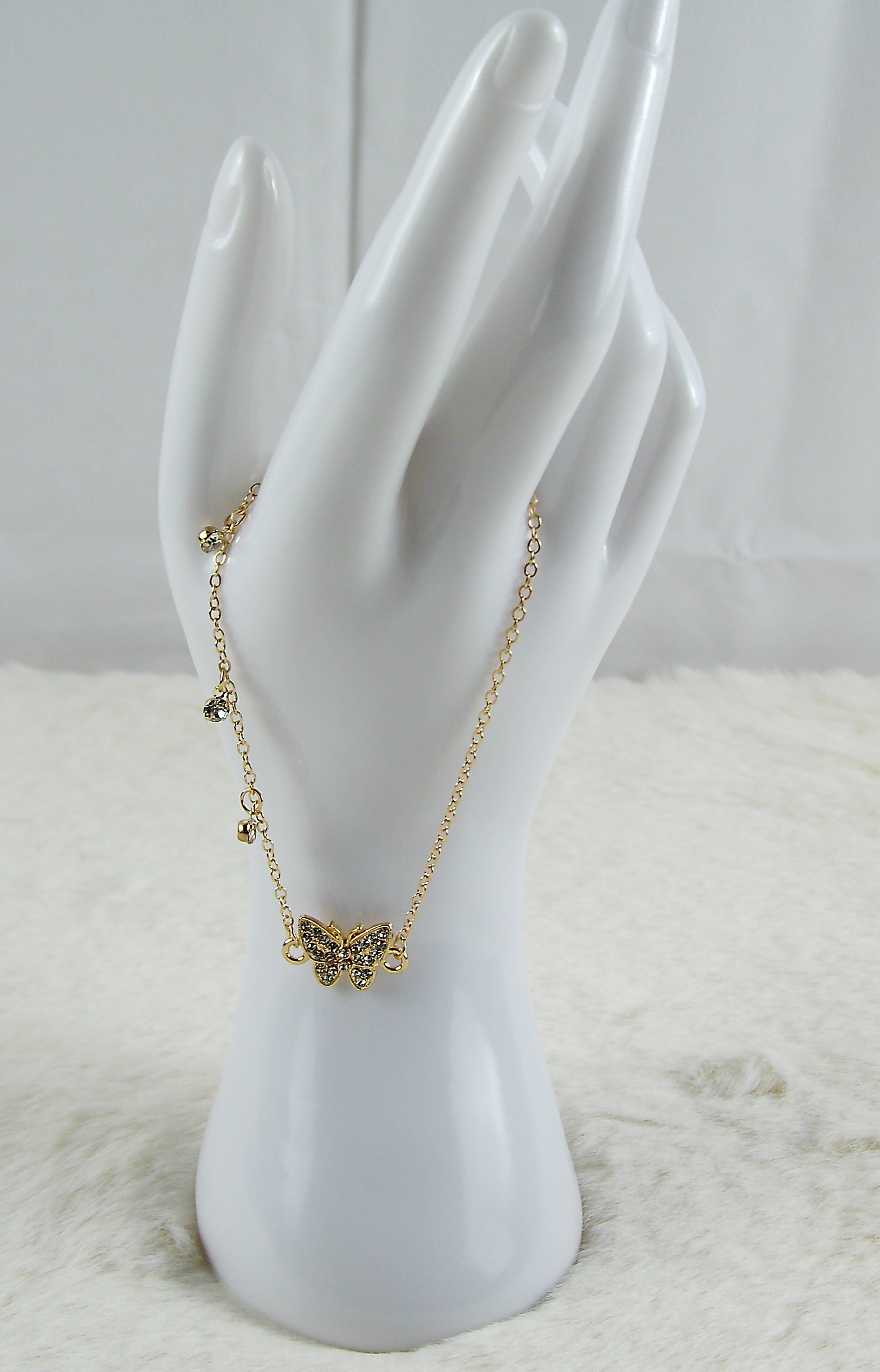 Gouden armband met vlinder diamantjes