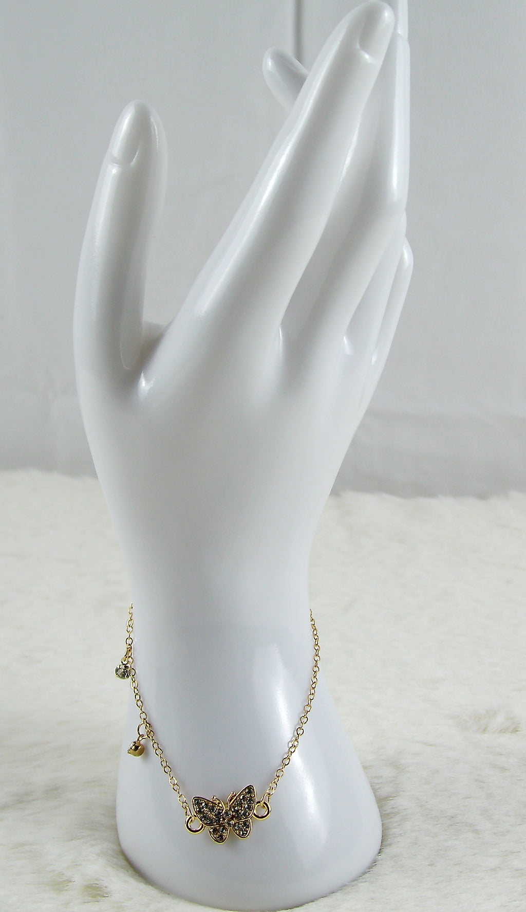 Gouden armband met vlinder diamantjes