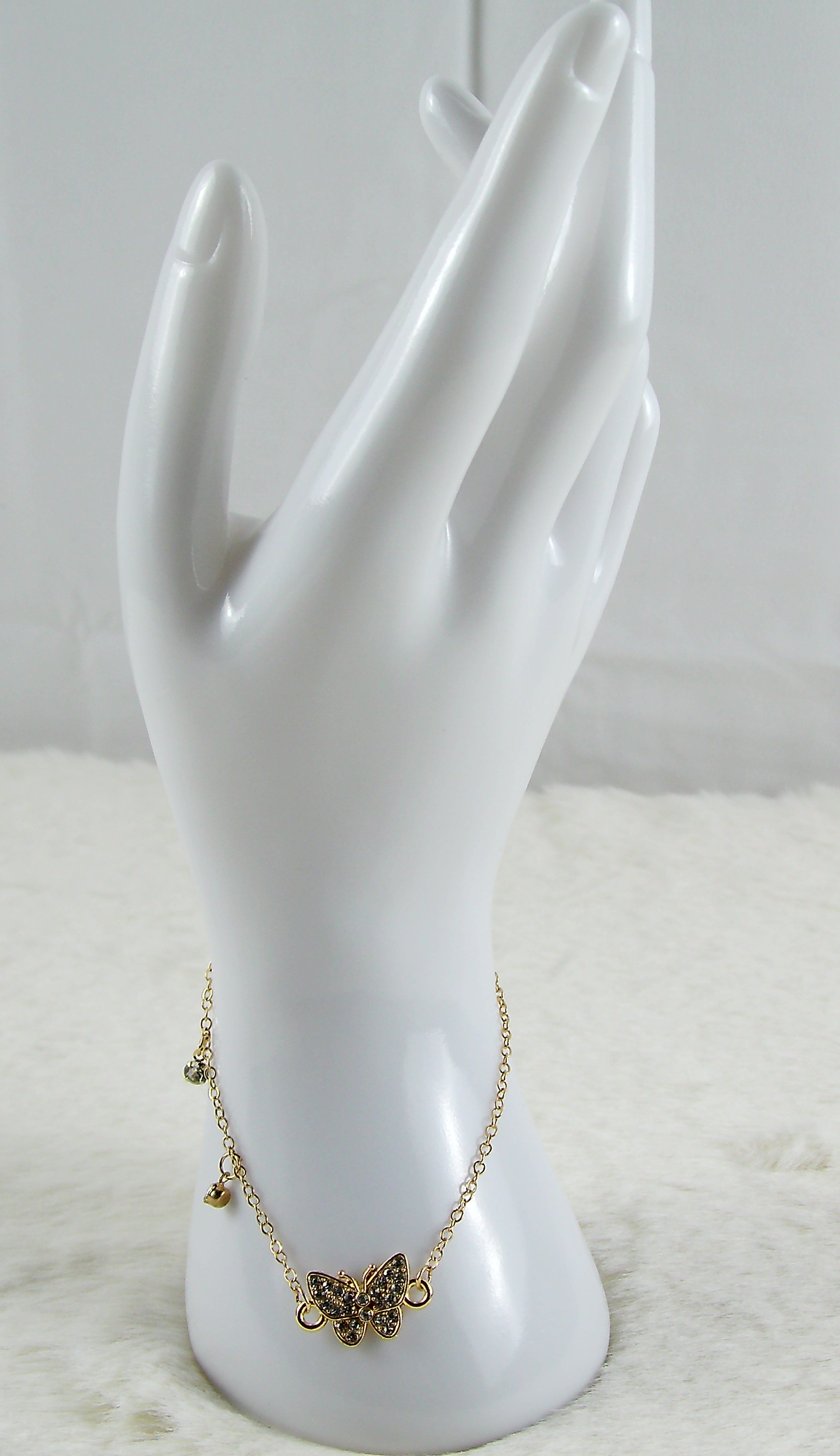 Gouden armband met vlinder diamantjes