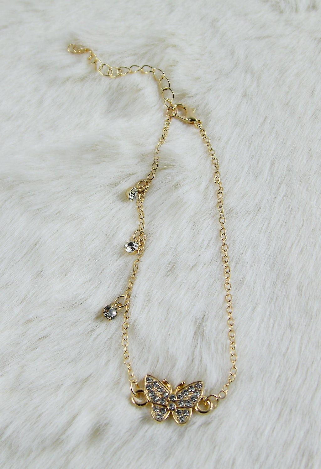 Gouden armband met vlinder diamantjes