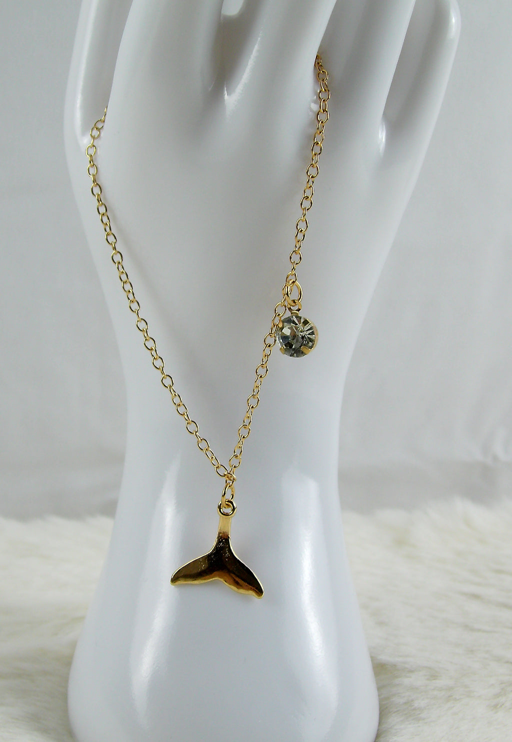 Gouden armband met zeemeerminstaart en diamant