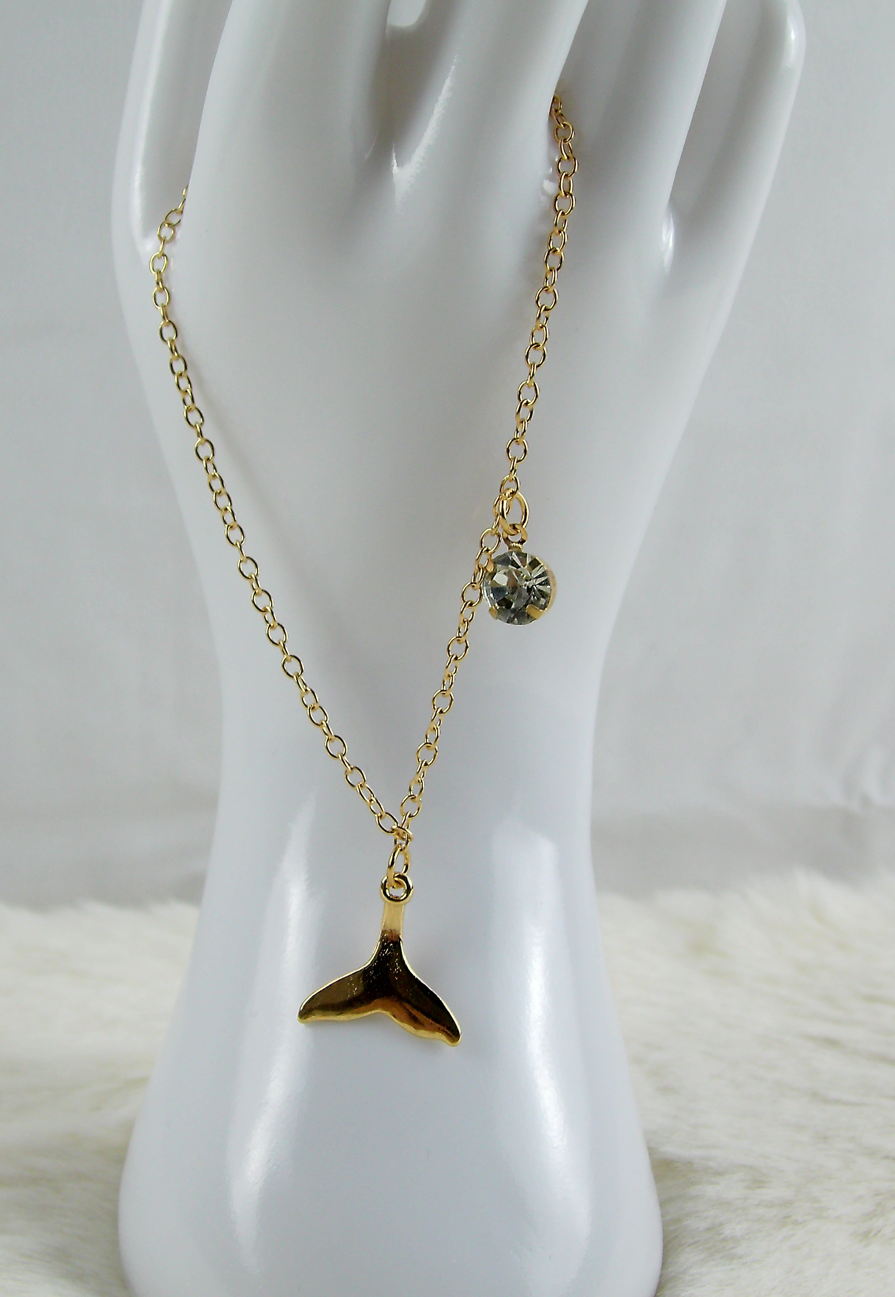 Gouden armband met zeemeerminstaart en diamant