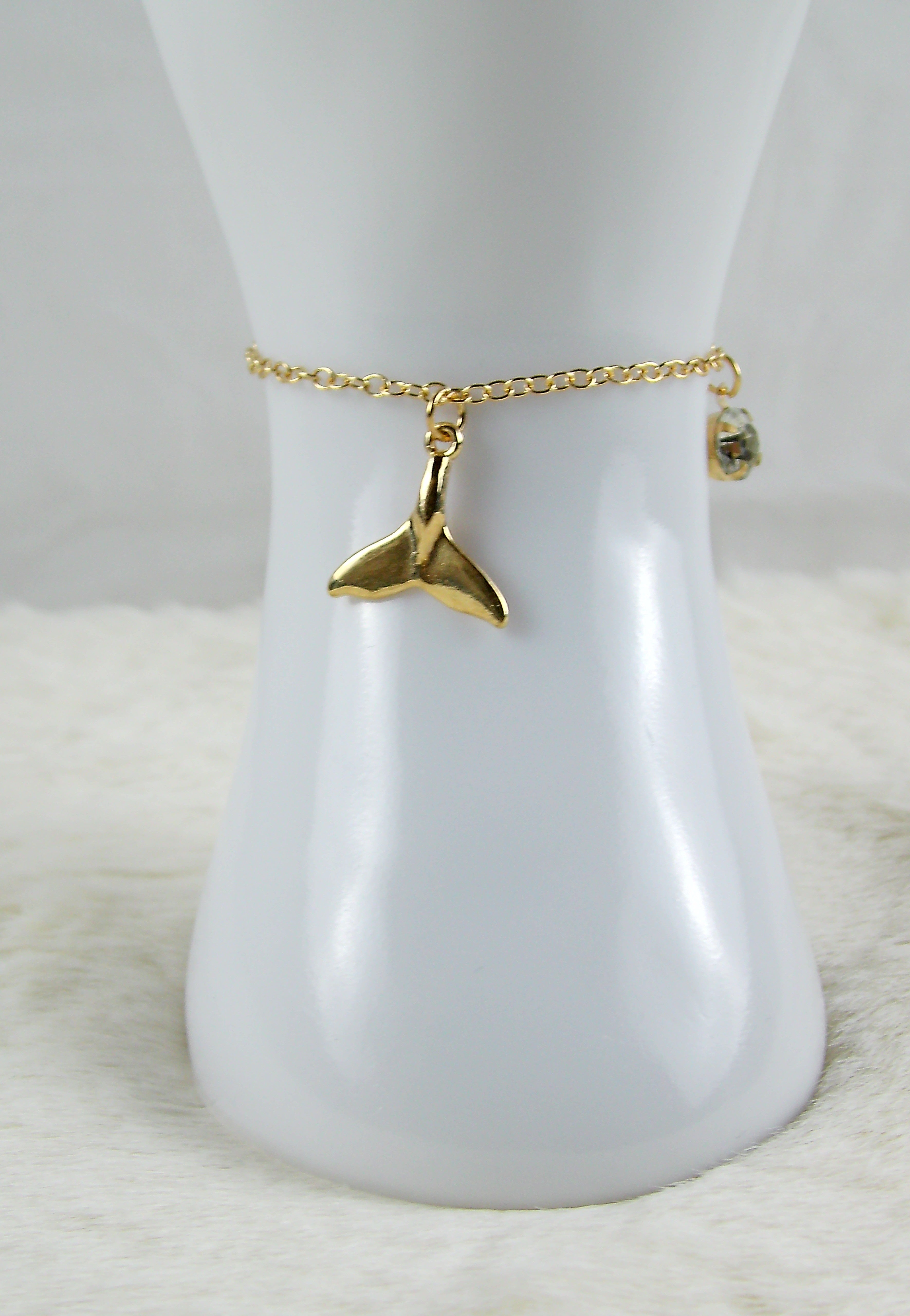 Gouden armband met zeemeerminstaart en diamant