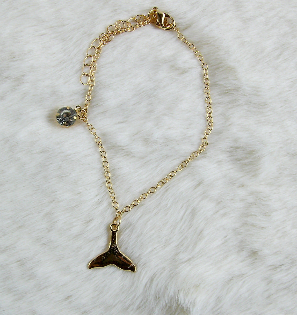 Gouden armband met zeemeerminstaart en diamant