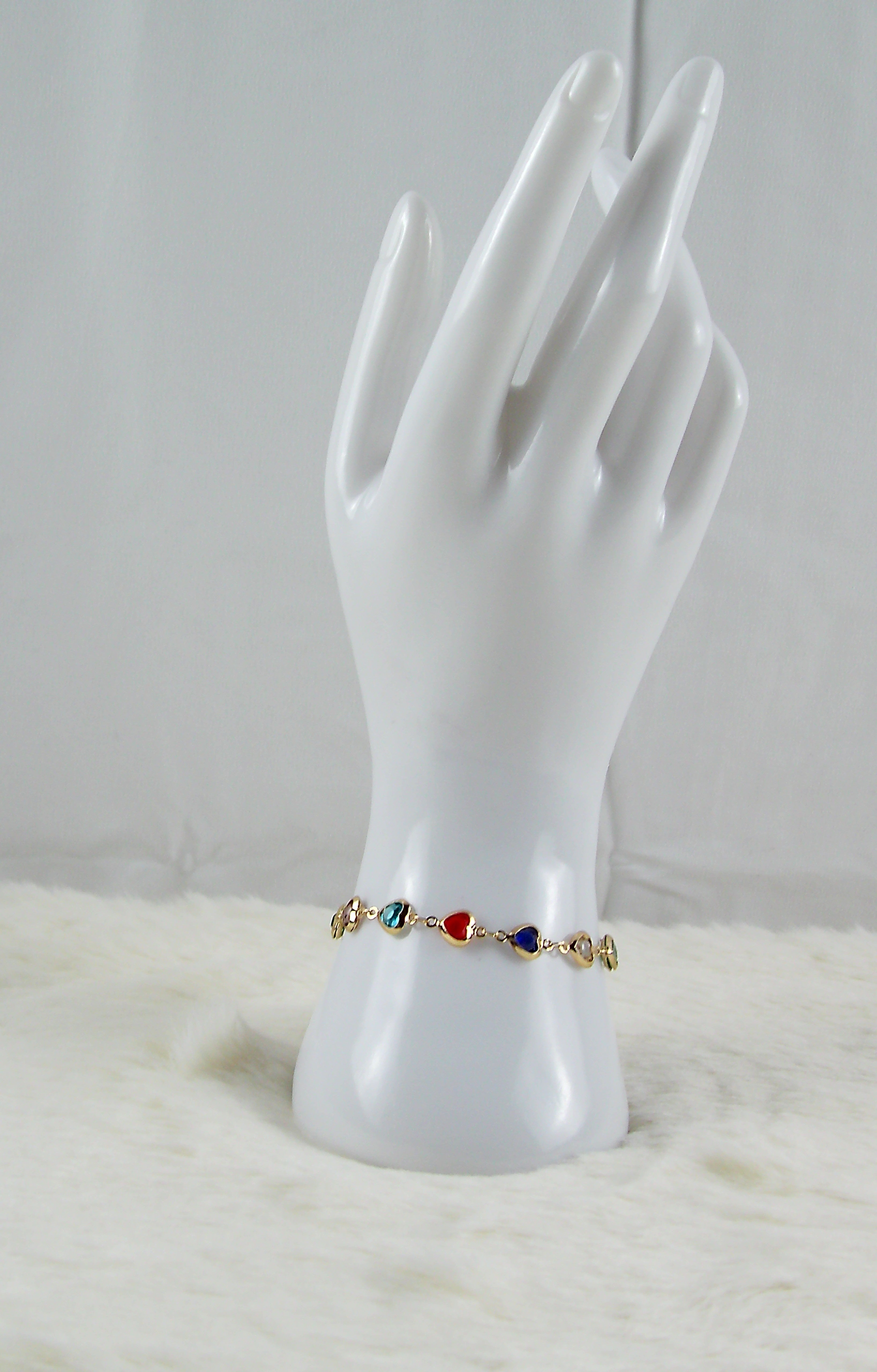 Gouden multicolor armband met hartje