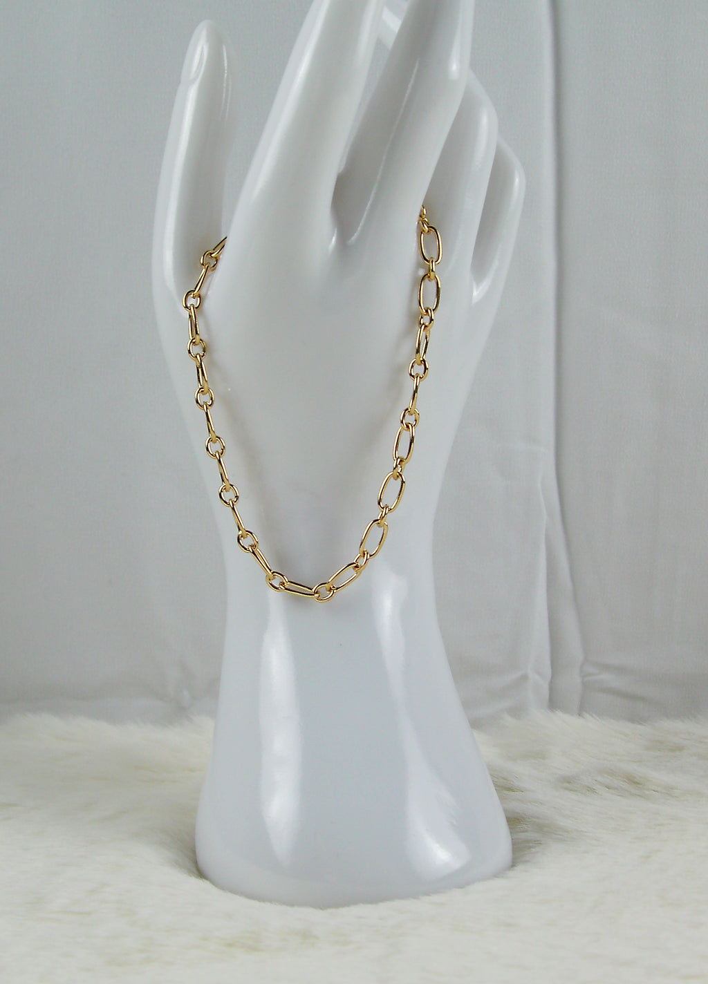 Gouden ringetjes armband met ovaaltjes