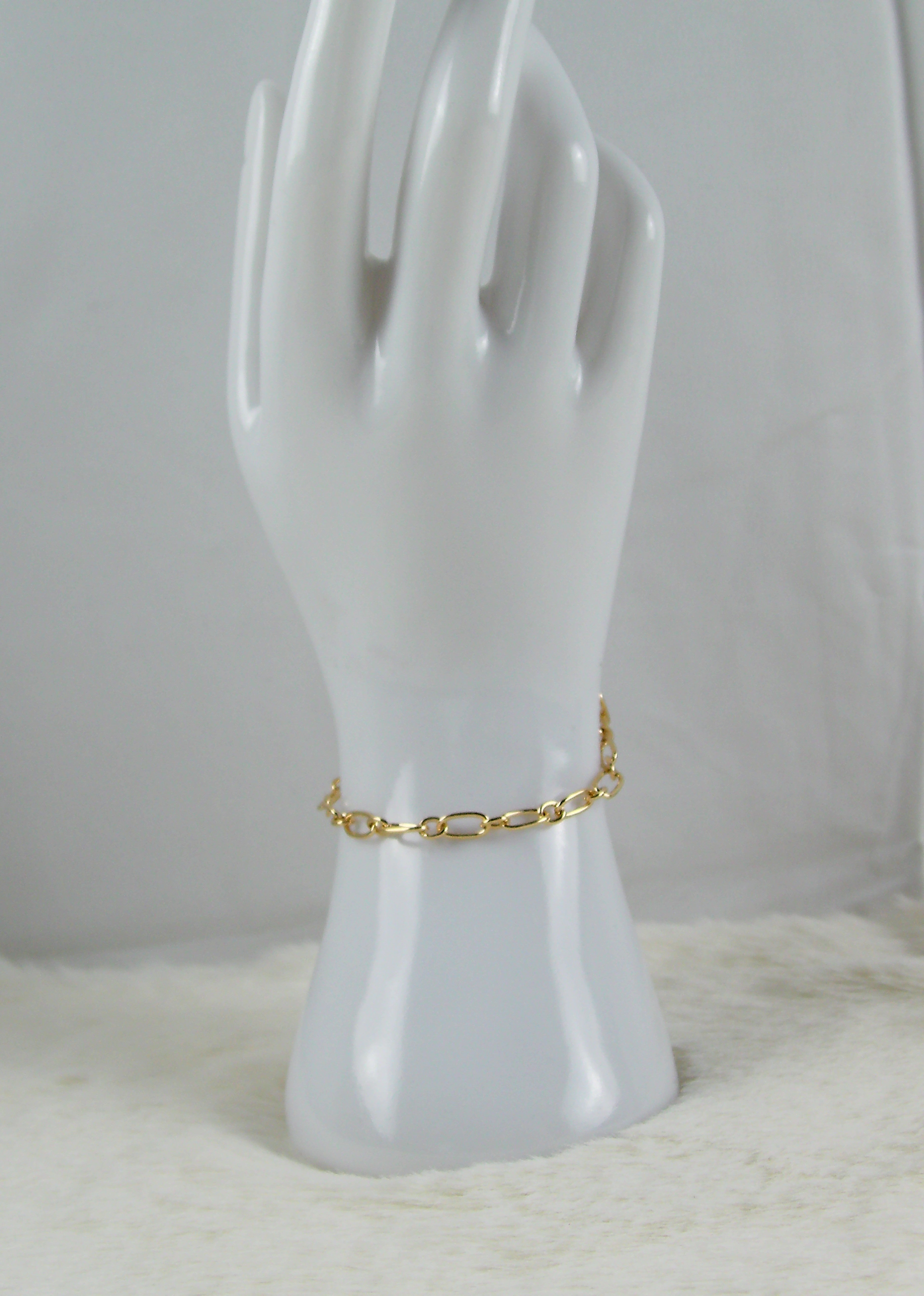Gouden ringetjes armband met ovaaltjes