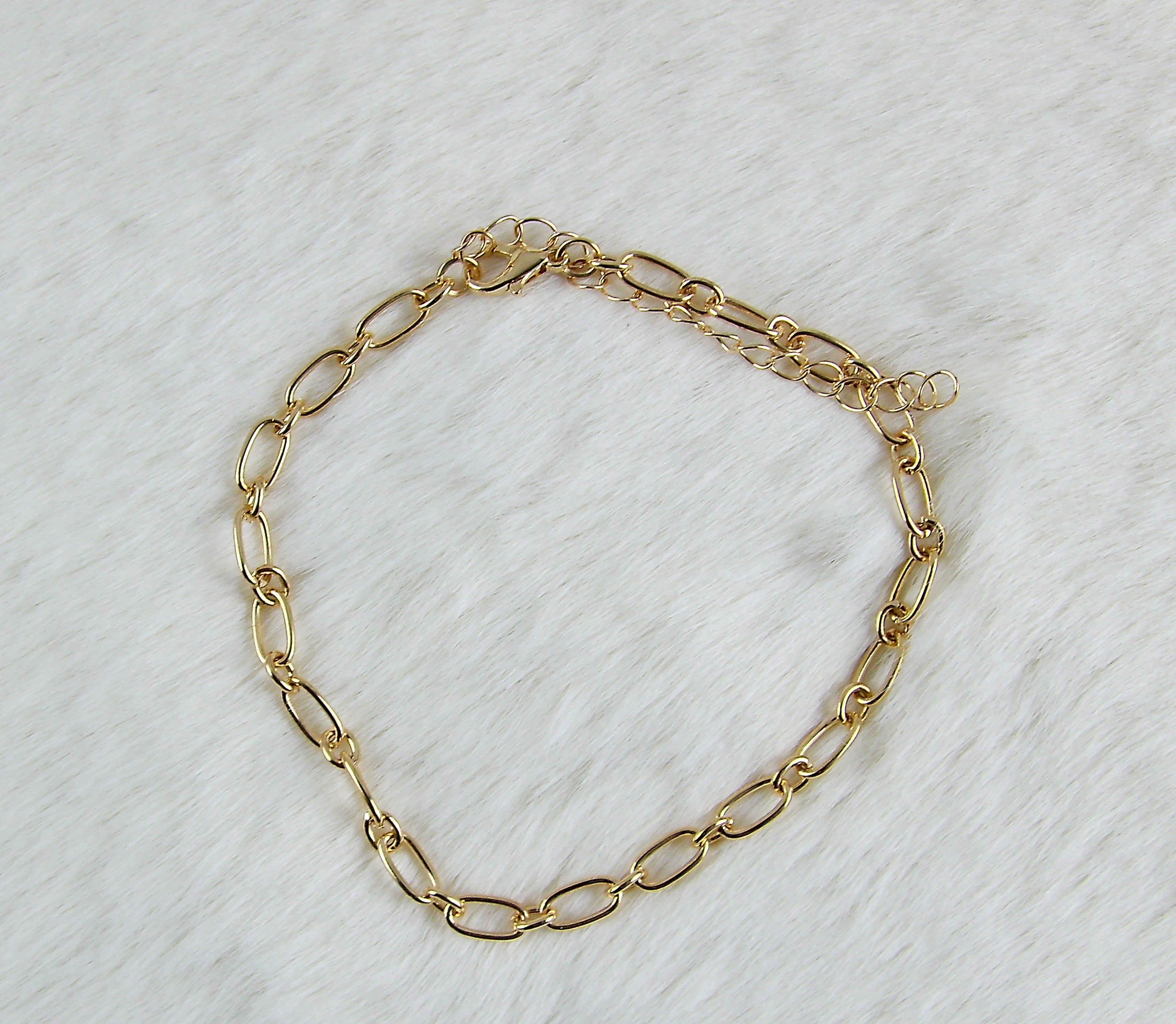 Gouden ringetjes armband met ovaaltjes