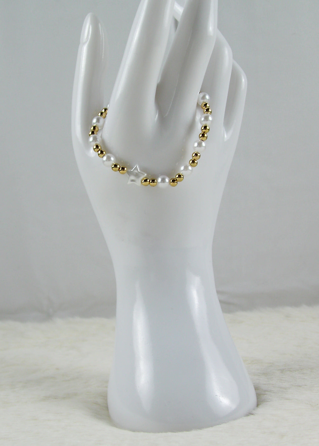 Goud met witte parel en ster kralen armband