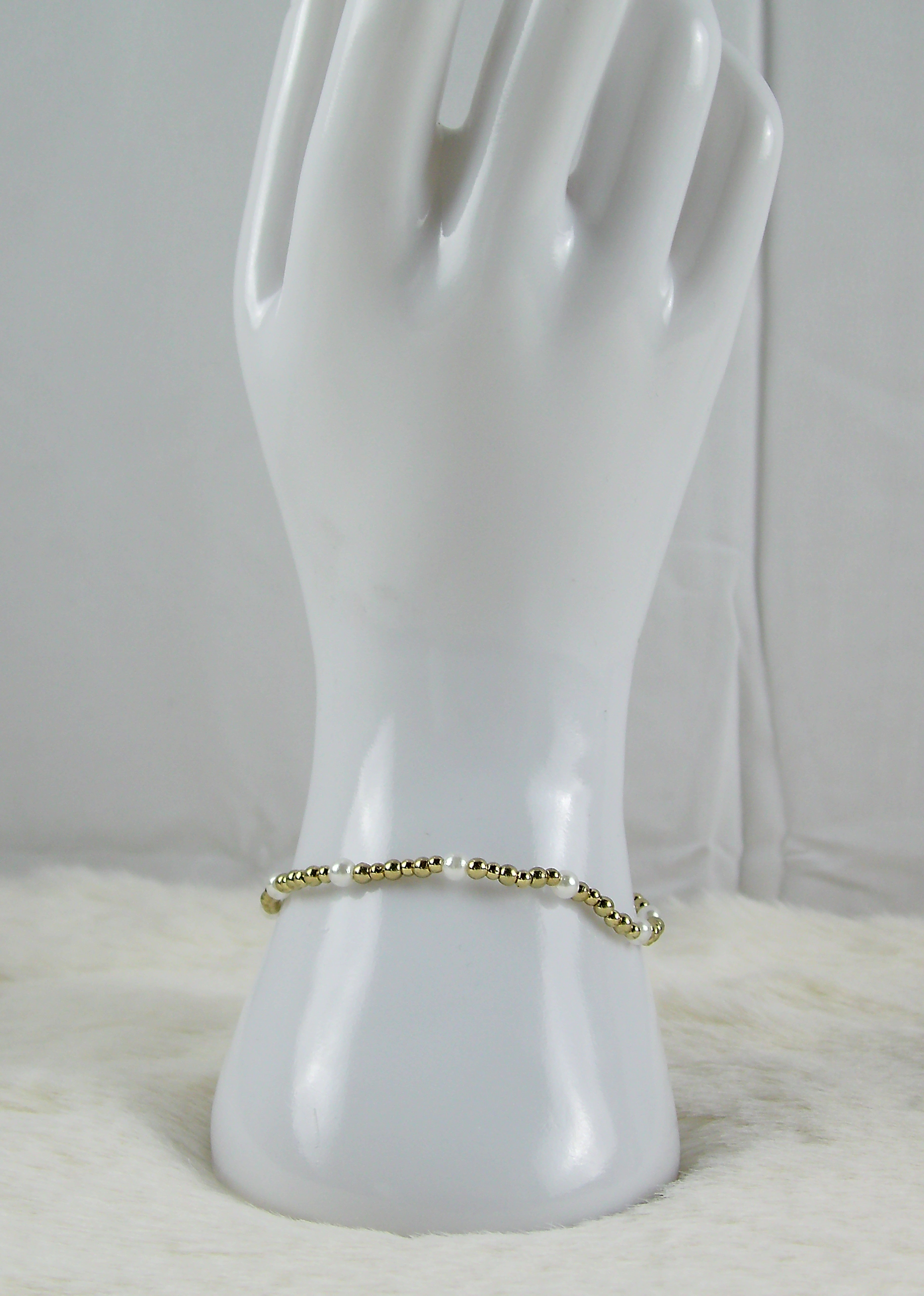 Gouden kralen armband met pareltjes