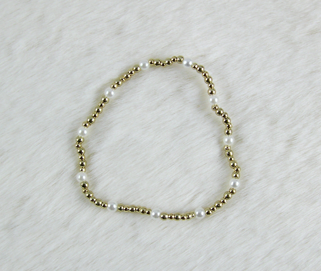 Gouden kralen armband met pareltjes