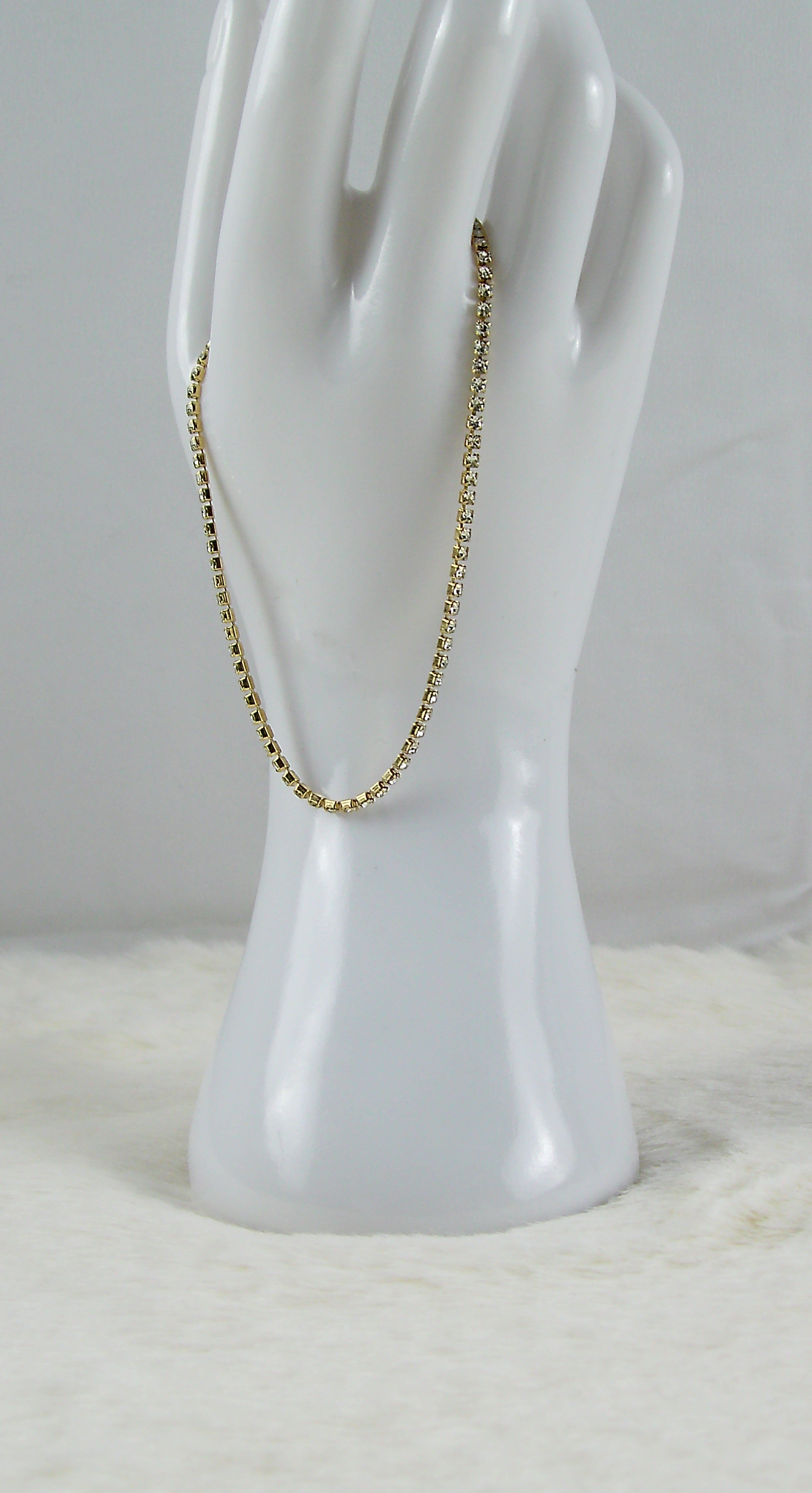 Gouden armband met zilvere diamantjes dichte schakeltjes