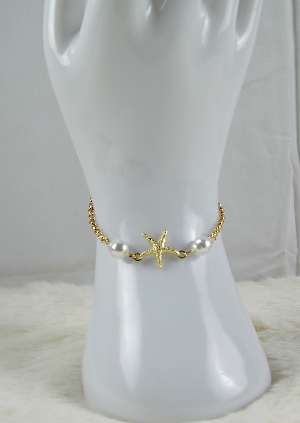 Gouden zee armbanden met ster en pareltjes