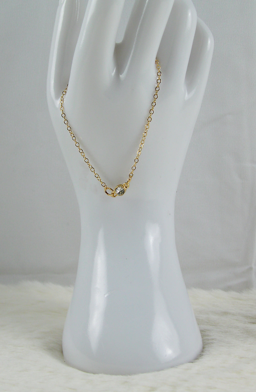 Gouden armband met diamant bedel