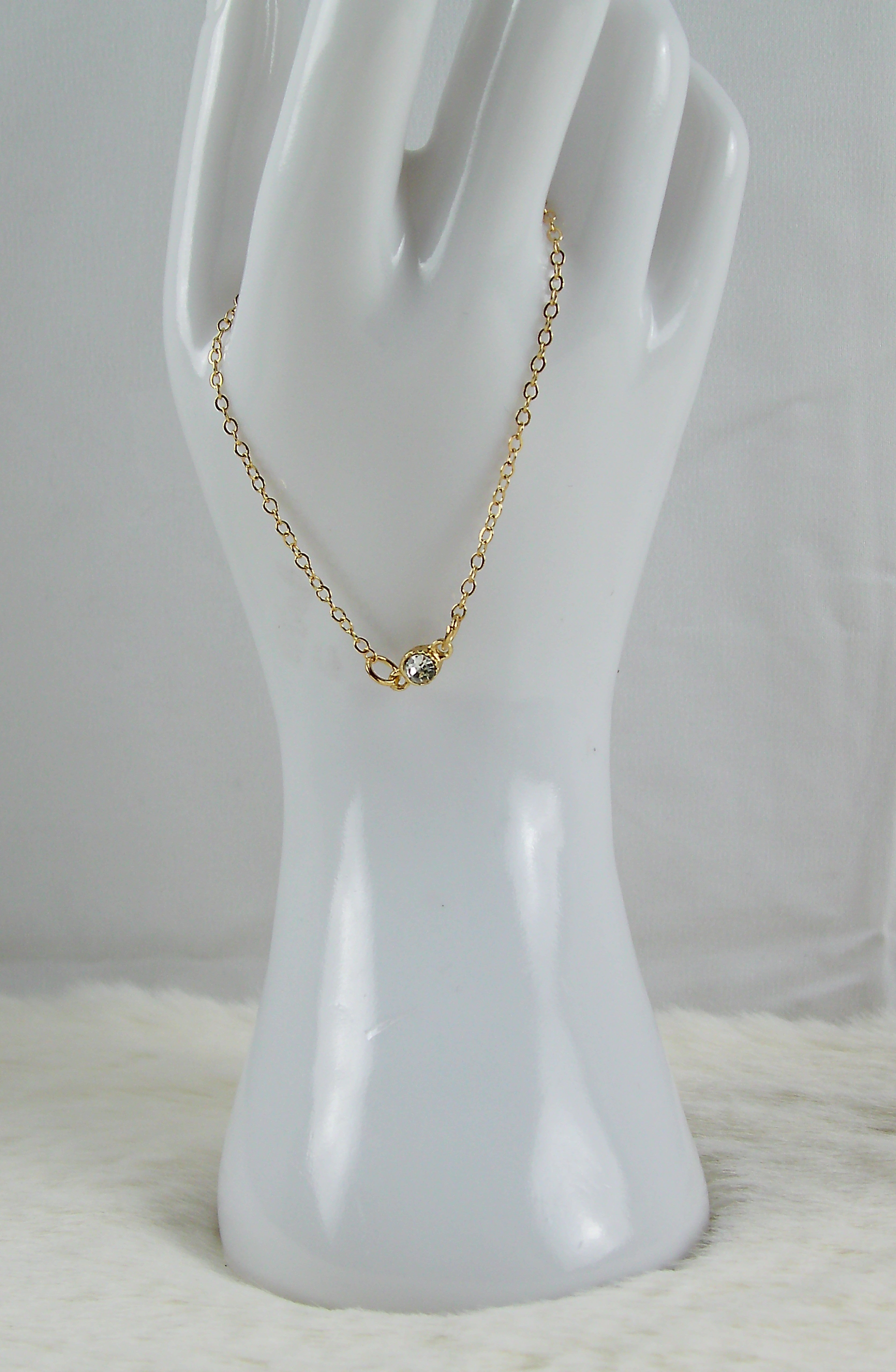Gouden armband met diamant bedel