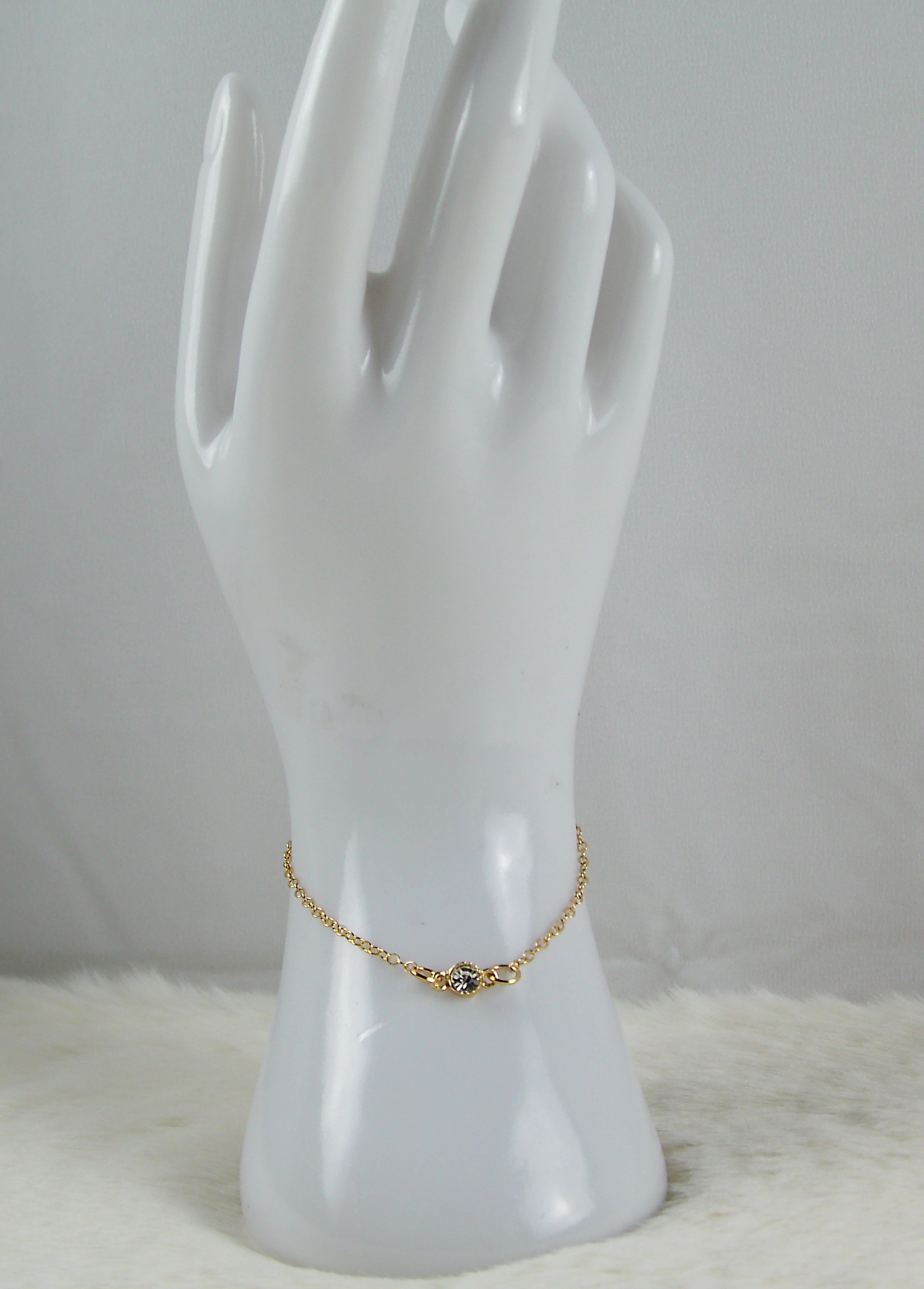 Gouden armband met diamant bedel