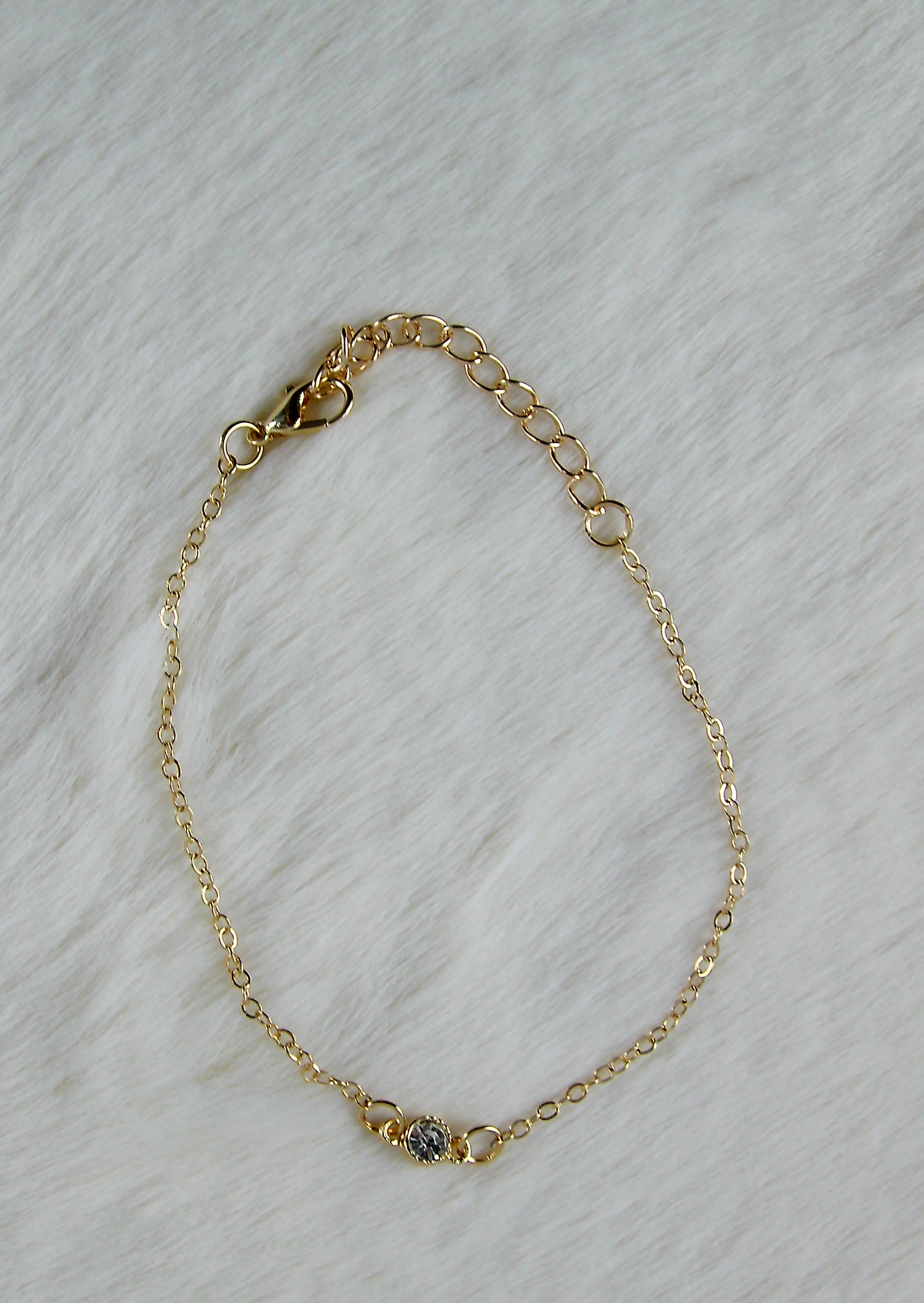 Gouden armband met diamant bedel
